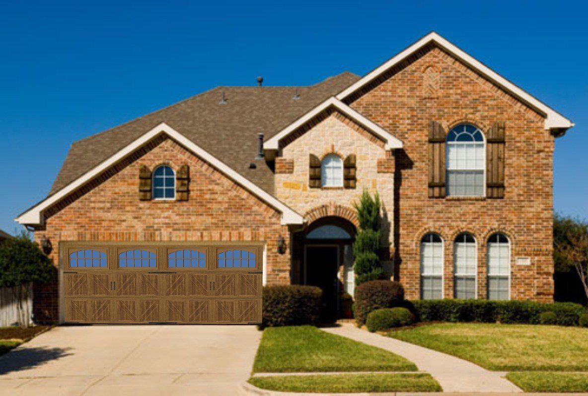 After design example showing a carriage-style wood-look garage door on the same brick home