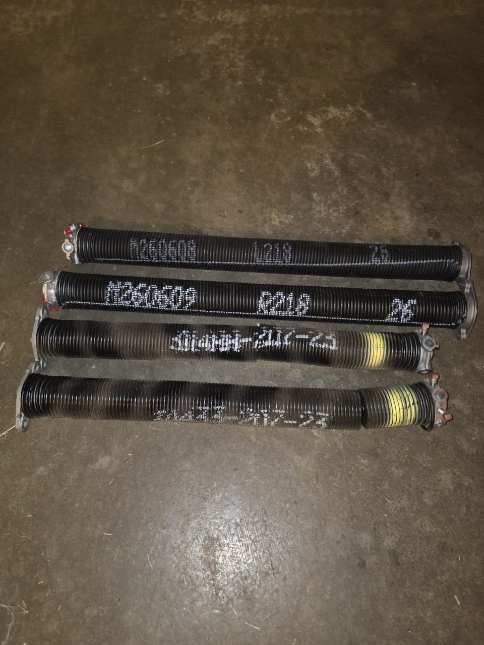 Old builder-grade springs versus new 25,000-cycle upgrade springs
