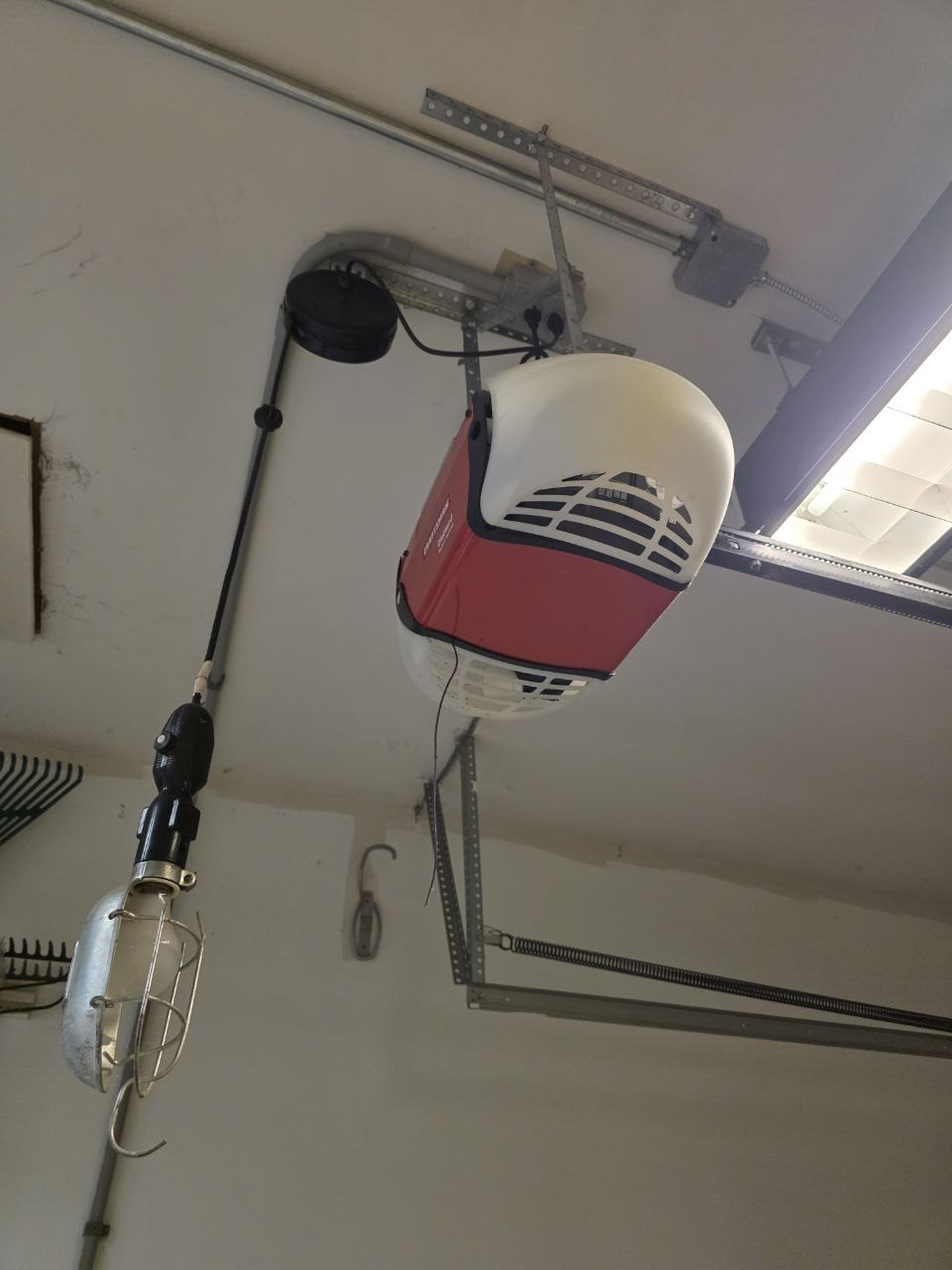 Old belt-drive garage door opener in Imperial, MO before replacement