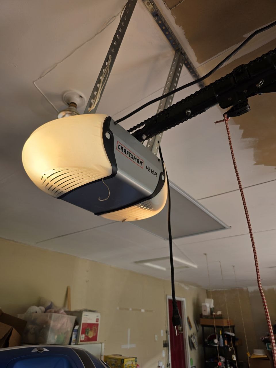Older Craftsman chain drive garage door opener before replacement
