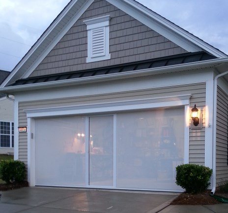 Garage screen installed on a home exterior